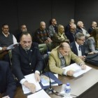 Los imputados Demarchi (de saco azul y barba) y Coronel (de anteojos y saco azul) ejercen sus defensas.